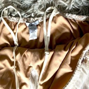 Beautiful lace white dress with two slits on the side.